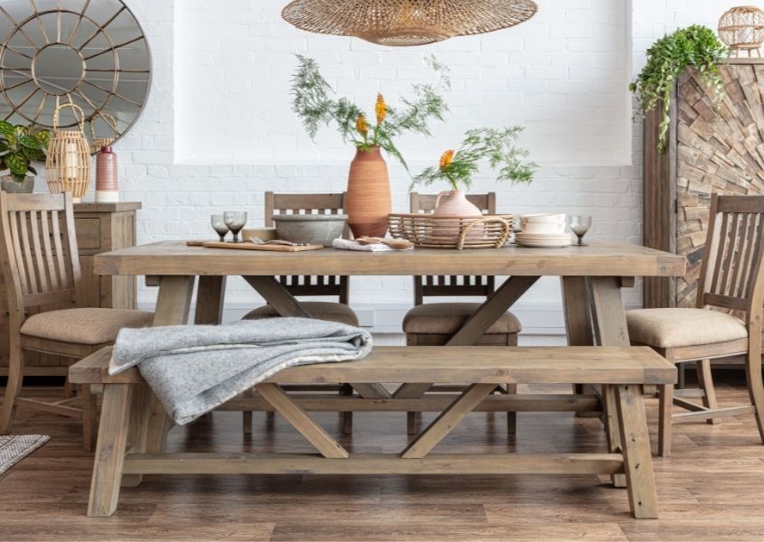 reclaimed wood dining table with terracotta vase