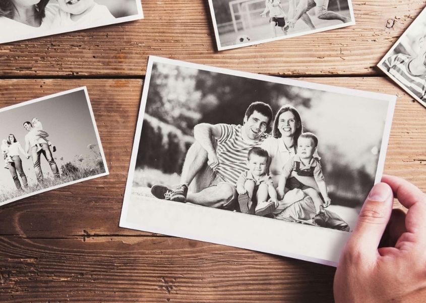 hand holding a black and white photograph