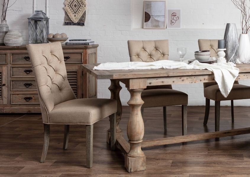 cream fabric dining chairs with reclaimed wood table