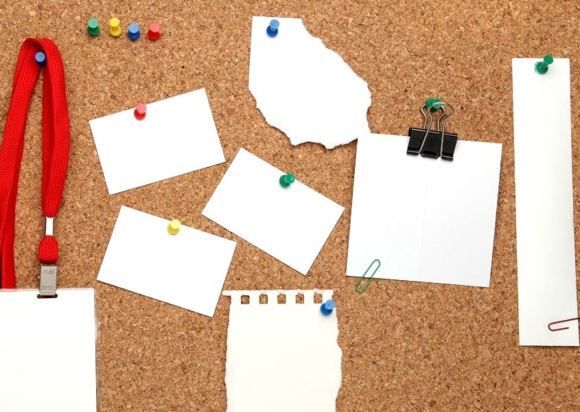cork noticeboard with pieces of paper pinned for how to set up the perfect study space for your child blog
