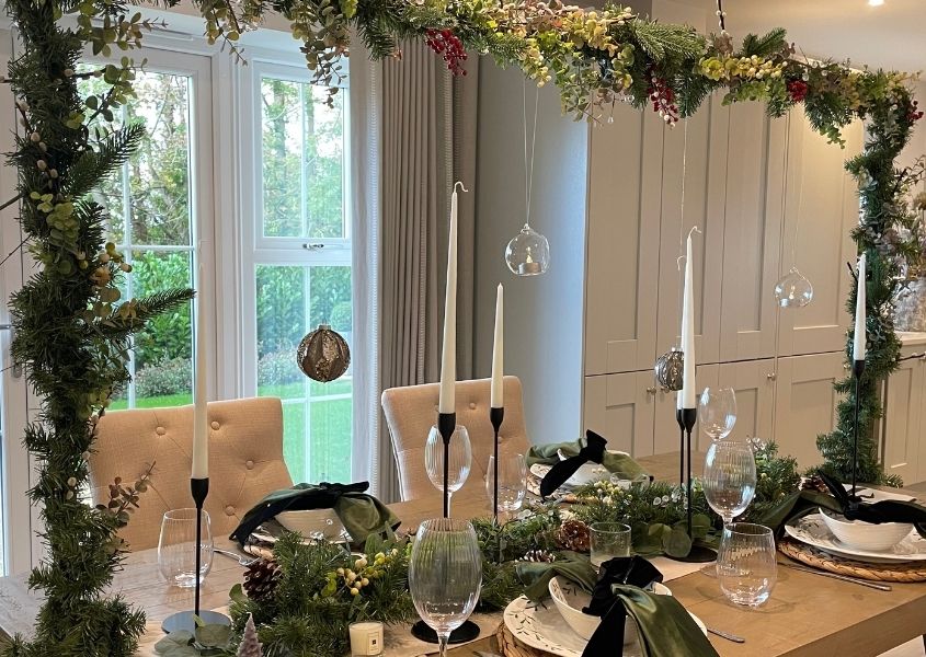 Christmas overhanging table decoration on reclaimed wood dining table