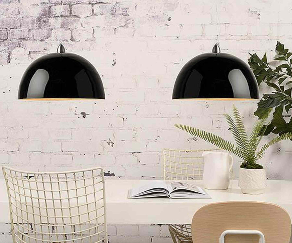 Black double pendant light over white table