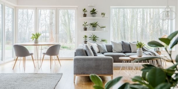 Open plan living/dining room with wrap around floor to ceiling window