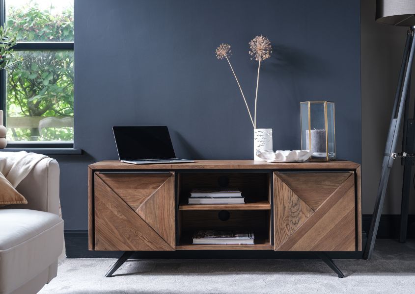 rustic oak tv stand against blue wall