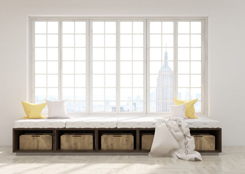 large window with built-in wicker storage baskets