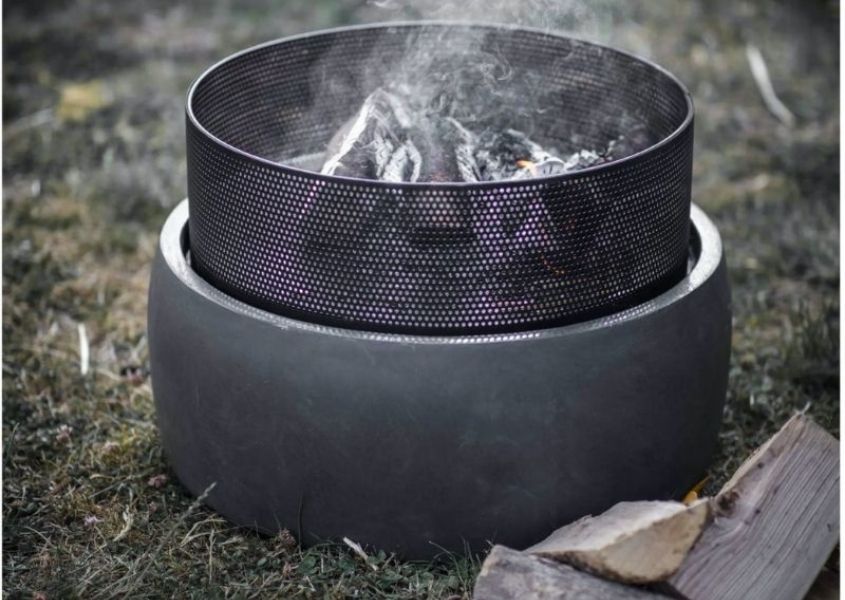 Small round steel fire pit with concrete base