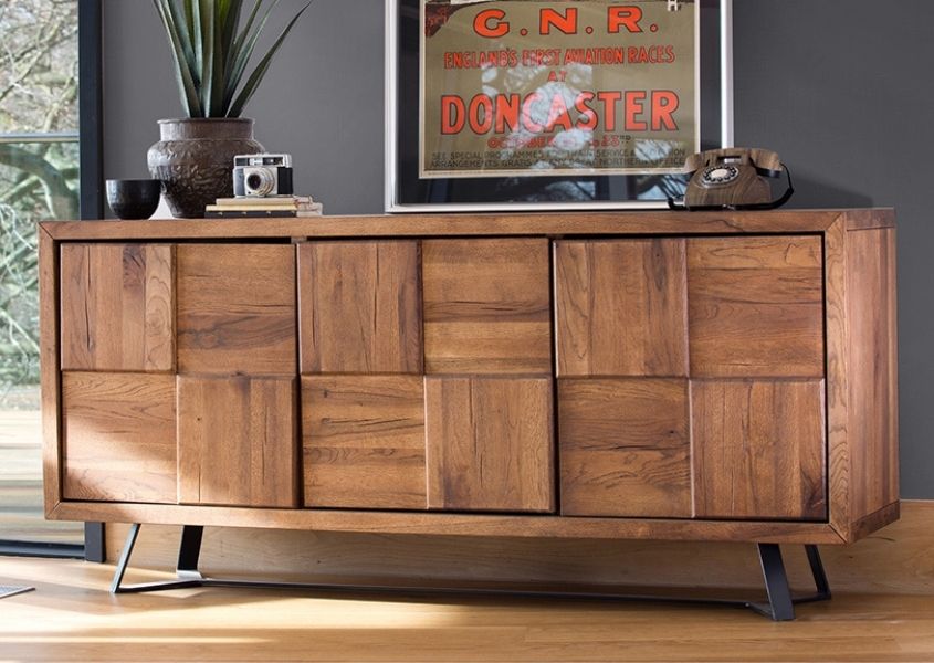 Mid century style sideboard against grey wall with ornaments on top and print behind