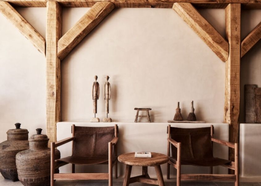 leather armchairs with wooden frame in lobby area of Habitat hotel, Mykonos