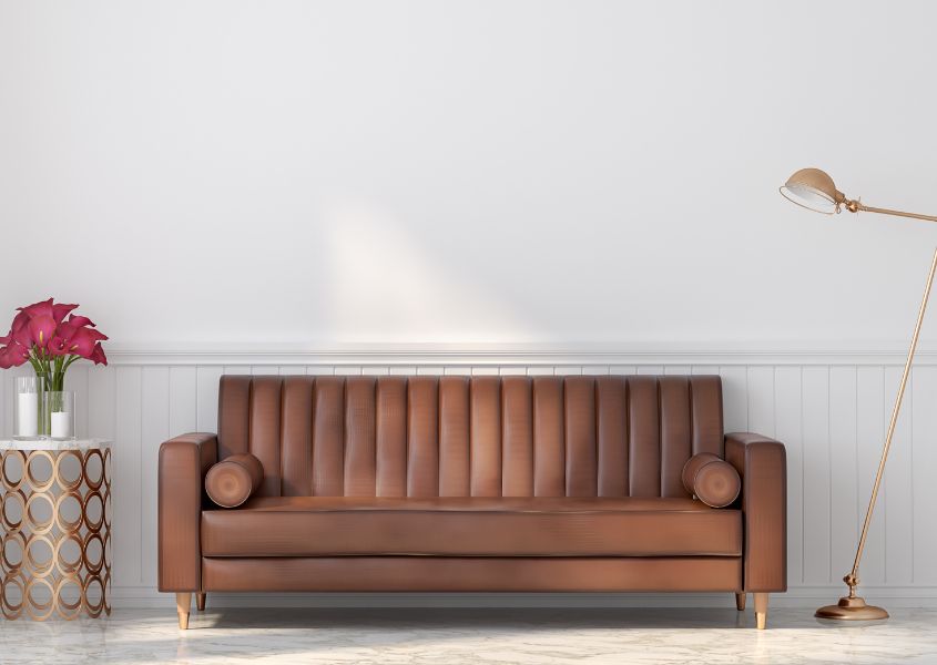 white living room with brown leather sofa