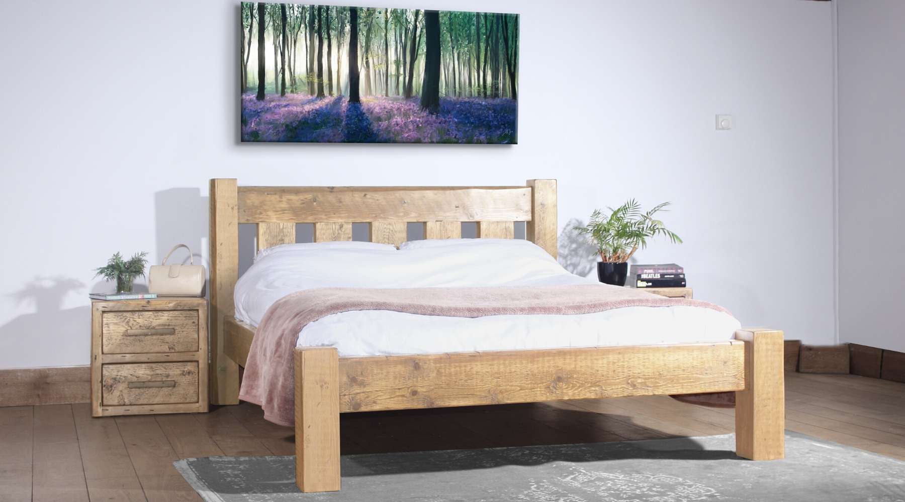 reclaimed wood bed with white bedding and throw