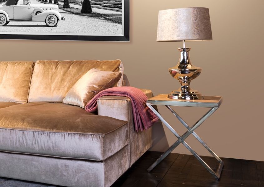 reclaimed wood side table next to silver fabric sofa