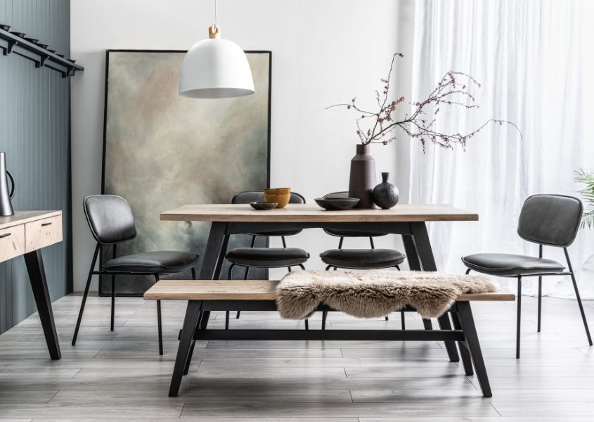 Reclaimed wood dining table with black painted legs