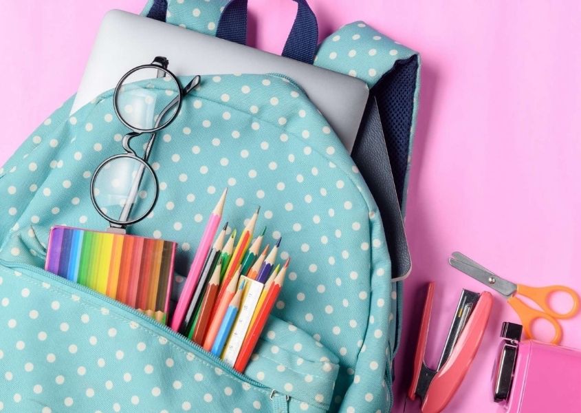 blue children's ruck sack with pencils and pens for Back to School blog