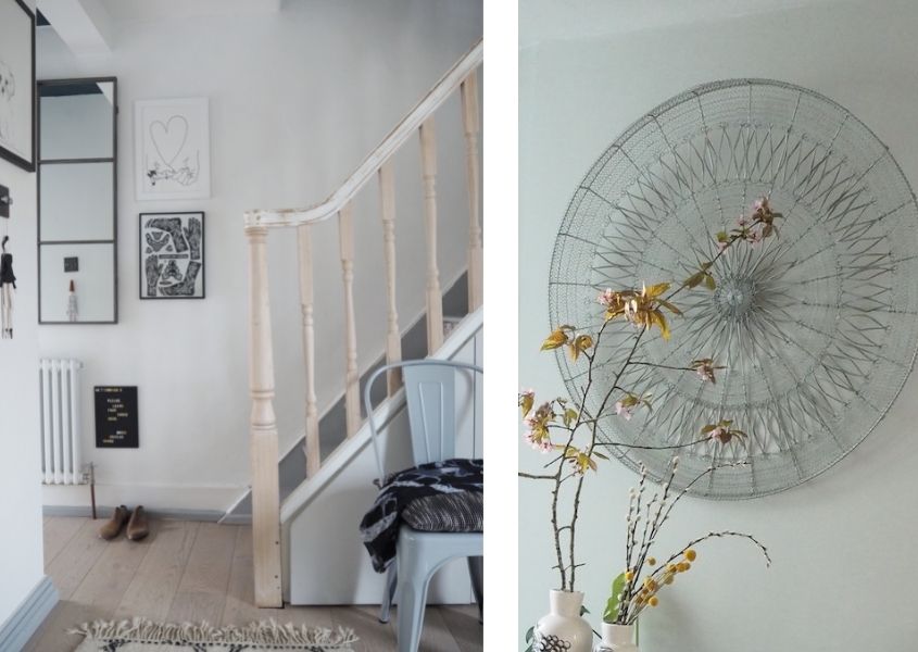 white hallway with blue industrial chair and round wire wall decoration