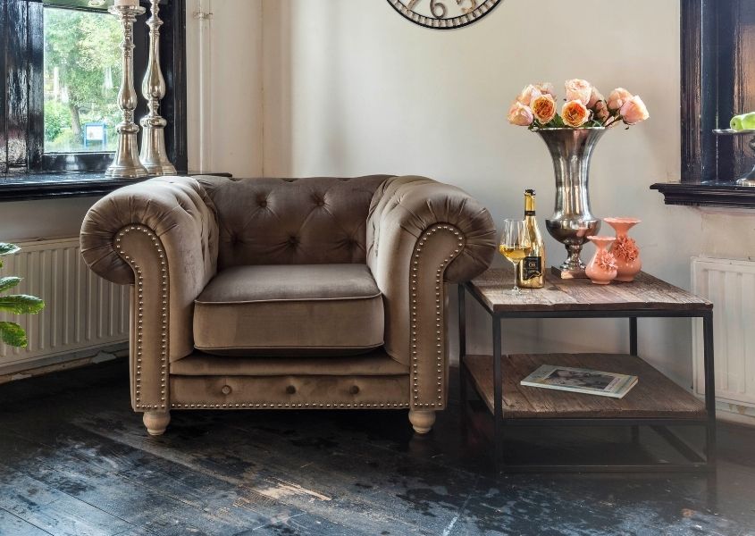 Brown leather armchair and industrial side table for Style tips to transform your coffee table blog