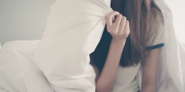 teenage girl under duvet