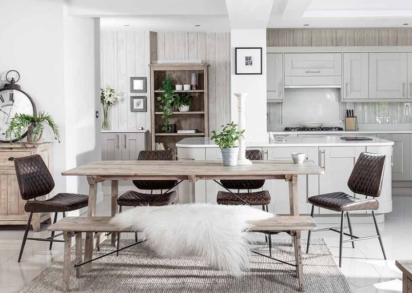 reclaimed wood dining table with brown faux leather dining chairs