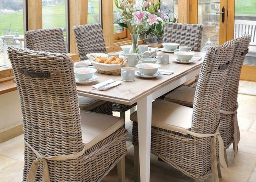 reclaimed wood dining table with rattan dining chairs