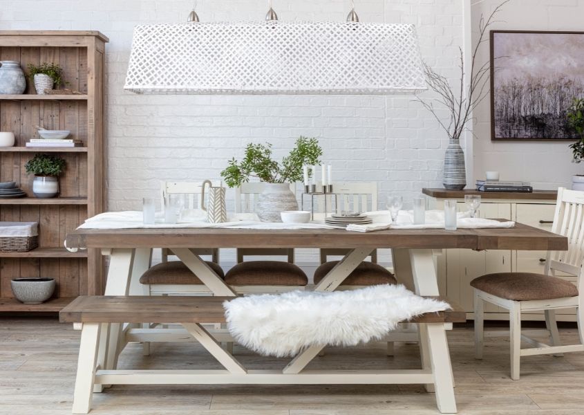 reclaimed wood dining table with white painted trestle legs and matching wooden bench