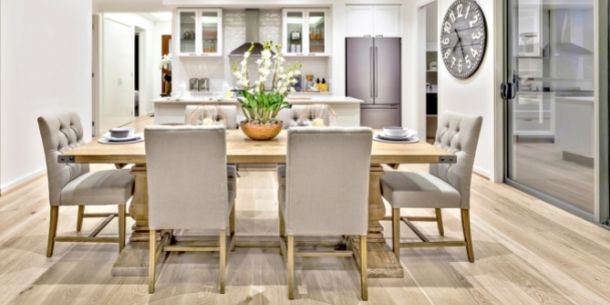 wooden dining table with grey fabric dining chairs