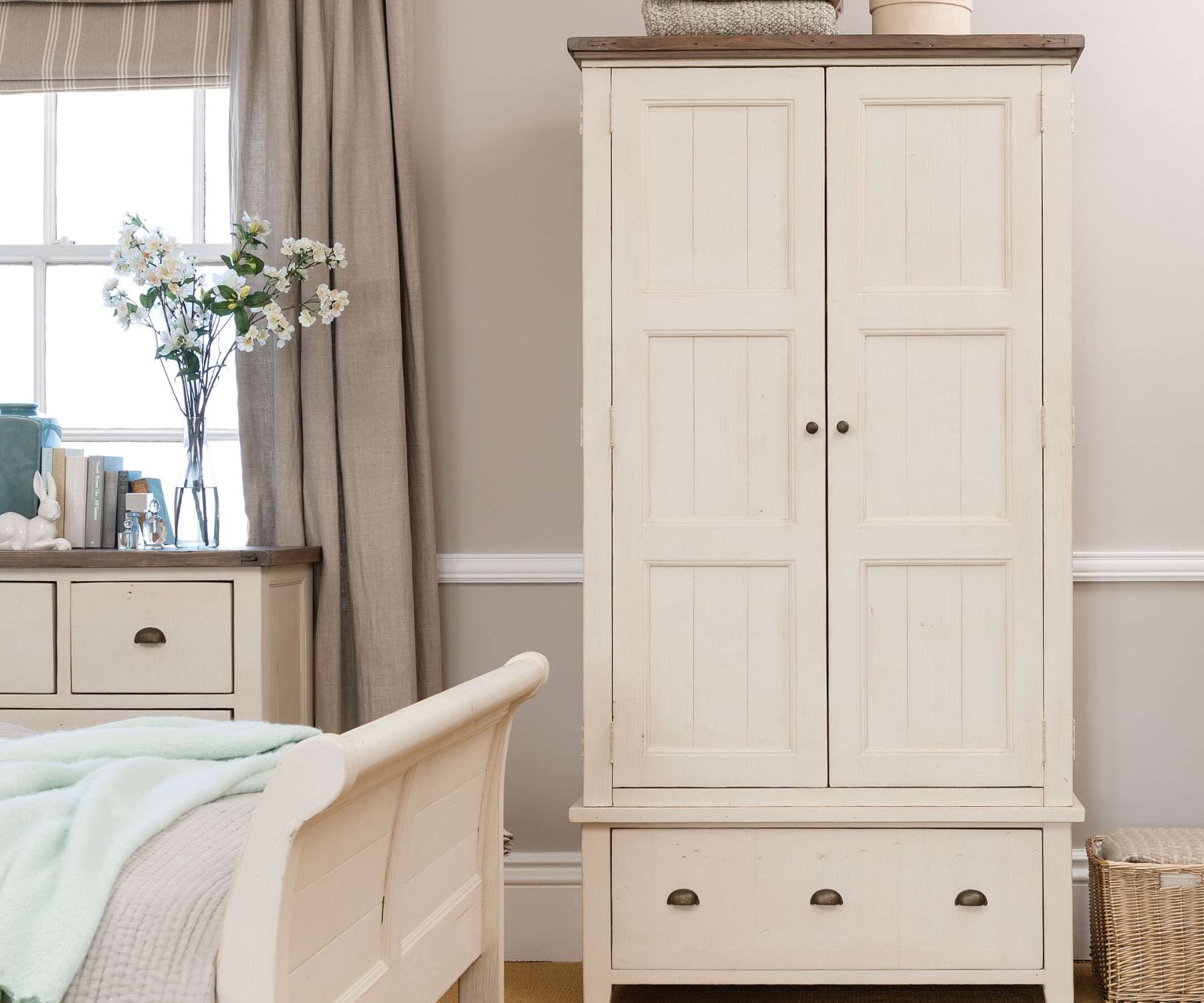 white wardrobe in pale coloured bedroom
