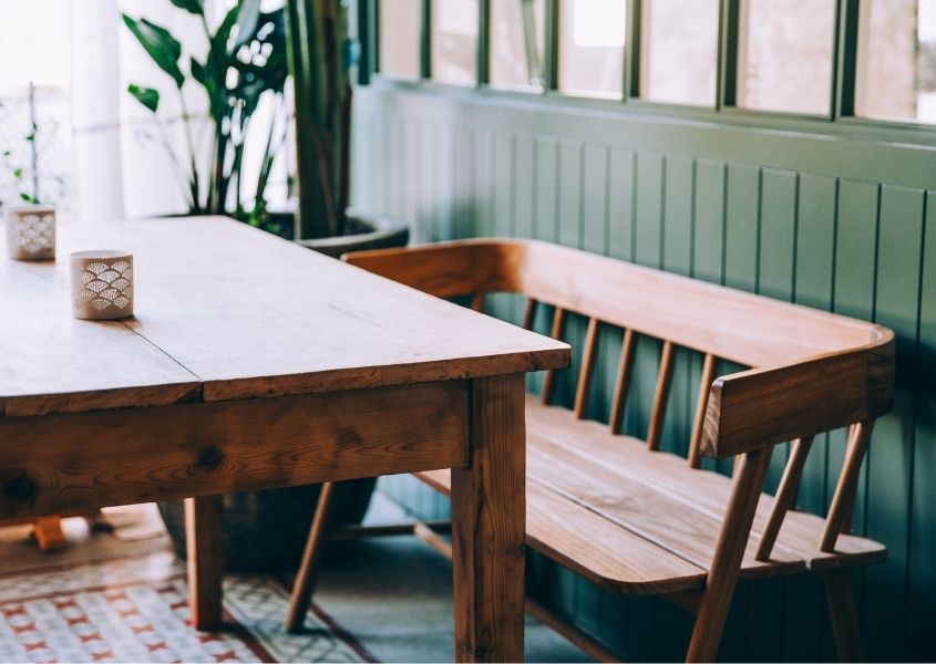 Wooden bench and table in the sun