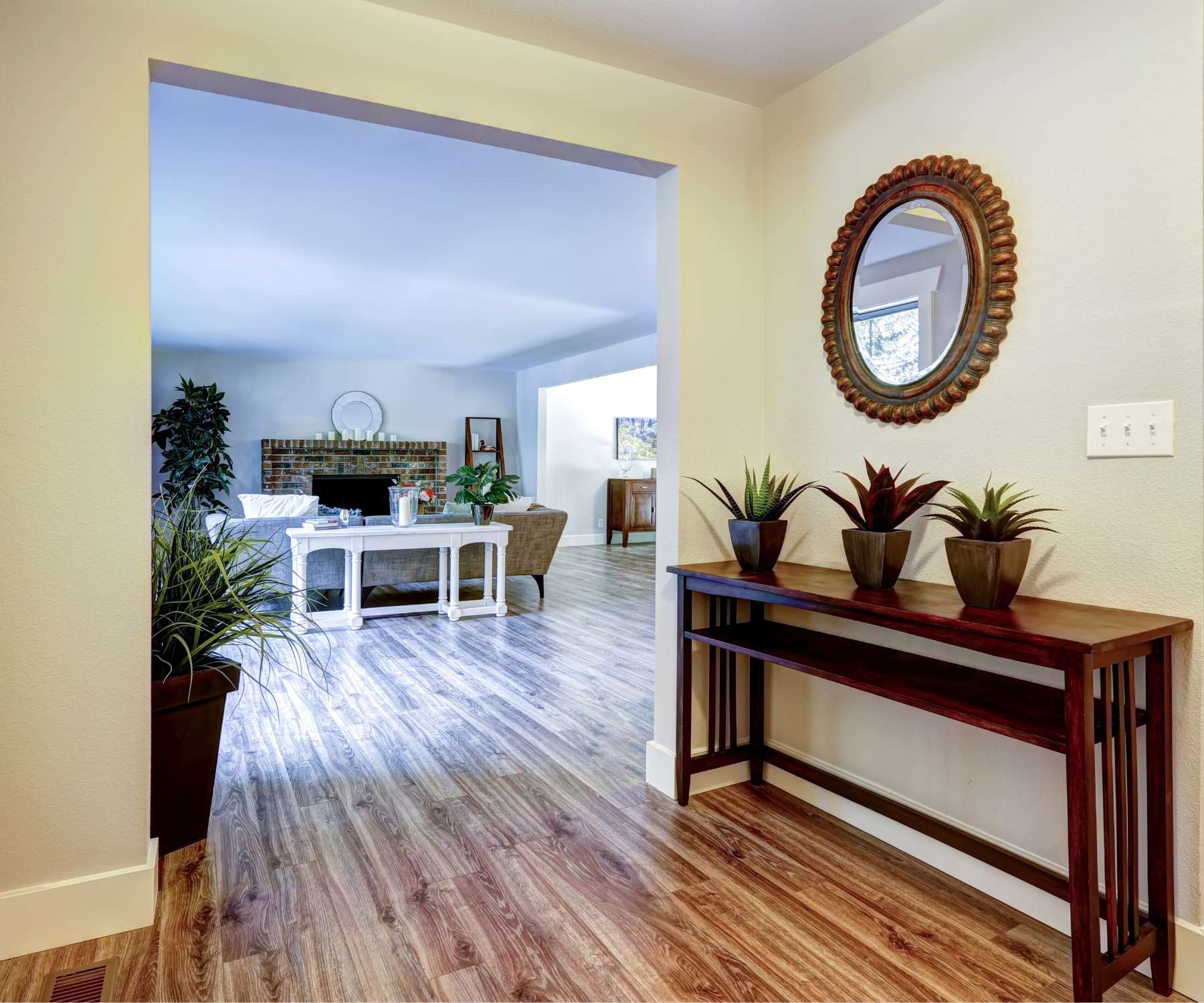 wooden console table with mirror above